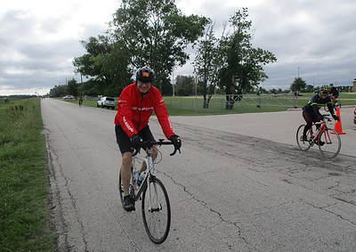 Enjoying a scenic bike ride with Bluebonnet Express cycling services on a cloudy day.