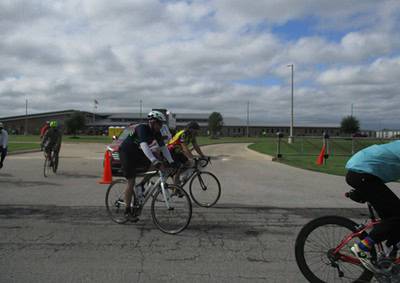 Cyclists participating in Bluebonnet Express cycling event on a cloudy day.
