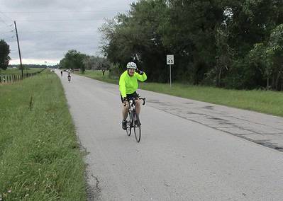 Bright neon cycling jacket on rider during Bluebonnet Express bike ride event.