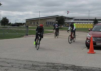 Cyclists participating in Bluebonnet Express bike ride at Elijay Jones Elementary School event.