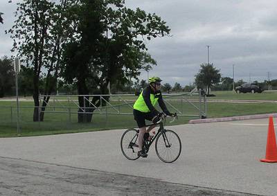 Cyclist wearing safety gear during Bluebonnet Express bike event, promoting safe cycling.