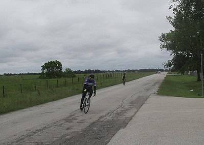 Scenic rural bike ride on Bluebonnet Express route with cyclists and open countryside.