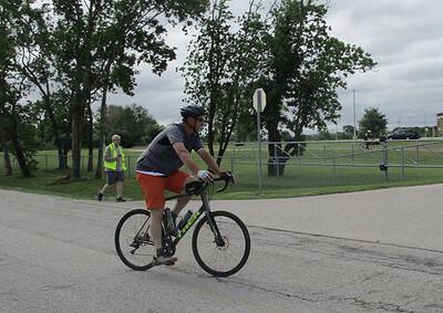 Bright cyclist on Bluebonnet Express bike trail, enjoying scenic outdoor ride in Texas.