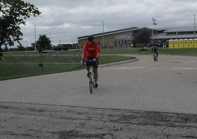 Bicycle riders at Bluebonnet Express event, scenic outdoor cycling race in Texas.