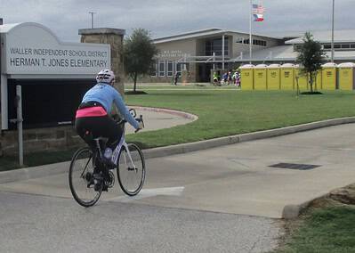 Bike rider on a road near Herman T. Jones Elementary School in Texas.