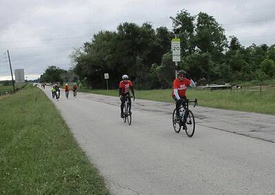 High school cycling event on rural road for Bluebonnet Express in Texas.