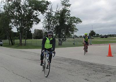 Cyclists riding during Bluebonnet Express bike event on a cloudy day in Texas.