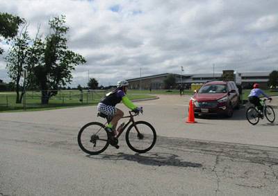 Pedestrian bike ride during Bluebonnet Express event on a cloudy day in Texas.