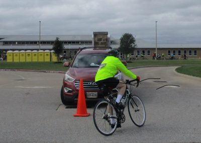 Sharp cyclist navigating road obstacle during Bluebonnet Express event, showcasing biking safety.