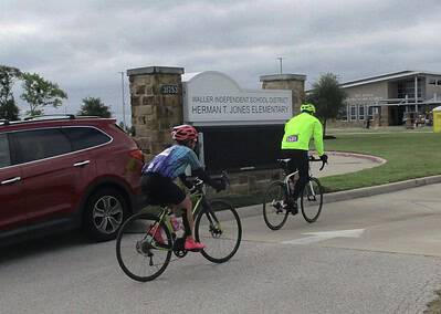 Cyclists riding near Herman T. Jones Elementary School on Bluebonnet Express bike route.