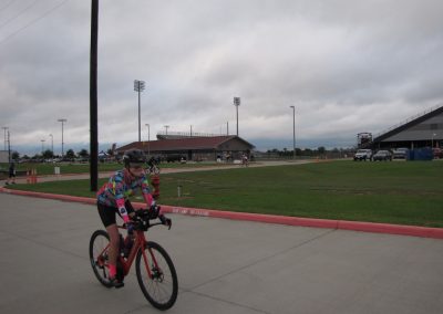 Girl riding a bike at Bluebonnet Express bike trail, outdoor cycling, recreational biking, Texas bike path, Bluebonnet Express route, family cycling, outdoor activity, bike safety, cycling event.
