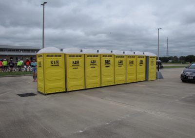 Portable toilets at Bluebonnet Express bike event in Texas.