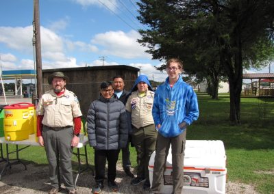 Group of scouts and leaders at Bluebonnet Express outdoor event, engaging in community activity and camping.