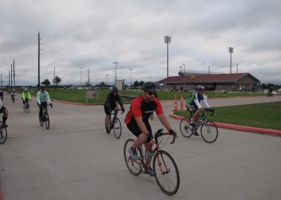 Scenic biking event at Bluebonnet Express with cyclists riding on a cloudy day in Texas.