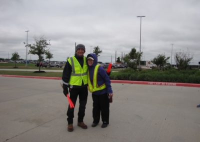 Brightly clad cyclists wearing safety vests at Bluebonnet Express, promoting safe biking and community engagement.