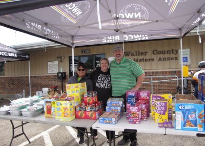 Bright bluebonnet express bike delivery under a canopy at Waller County Old Store Annex.