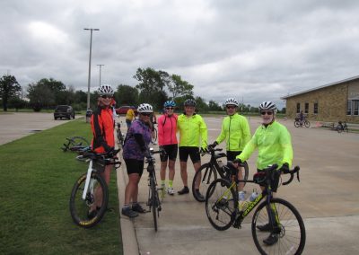 Group of cyclists on a scenic ride, promoting Bluebonnet Express bike trail and outdoor recreation.
