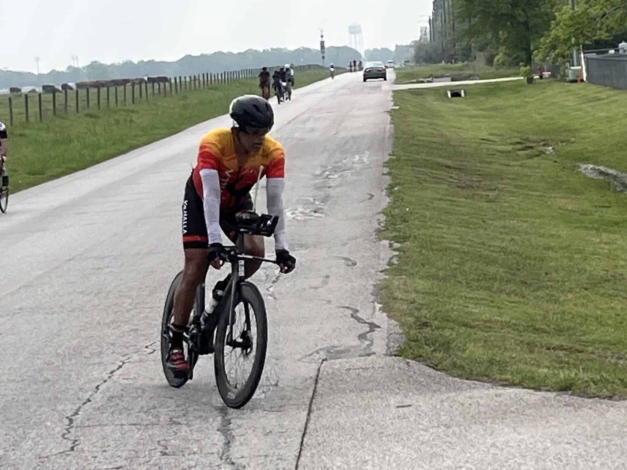 Velo cyclist riding on a rural road for Bluebonnet Express event.