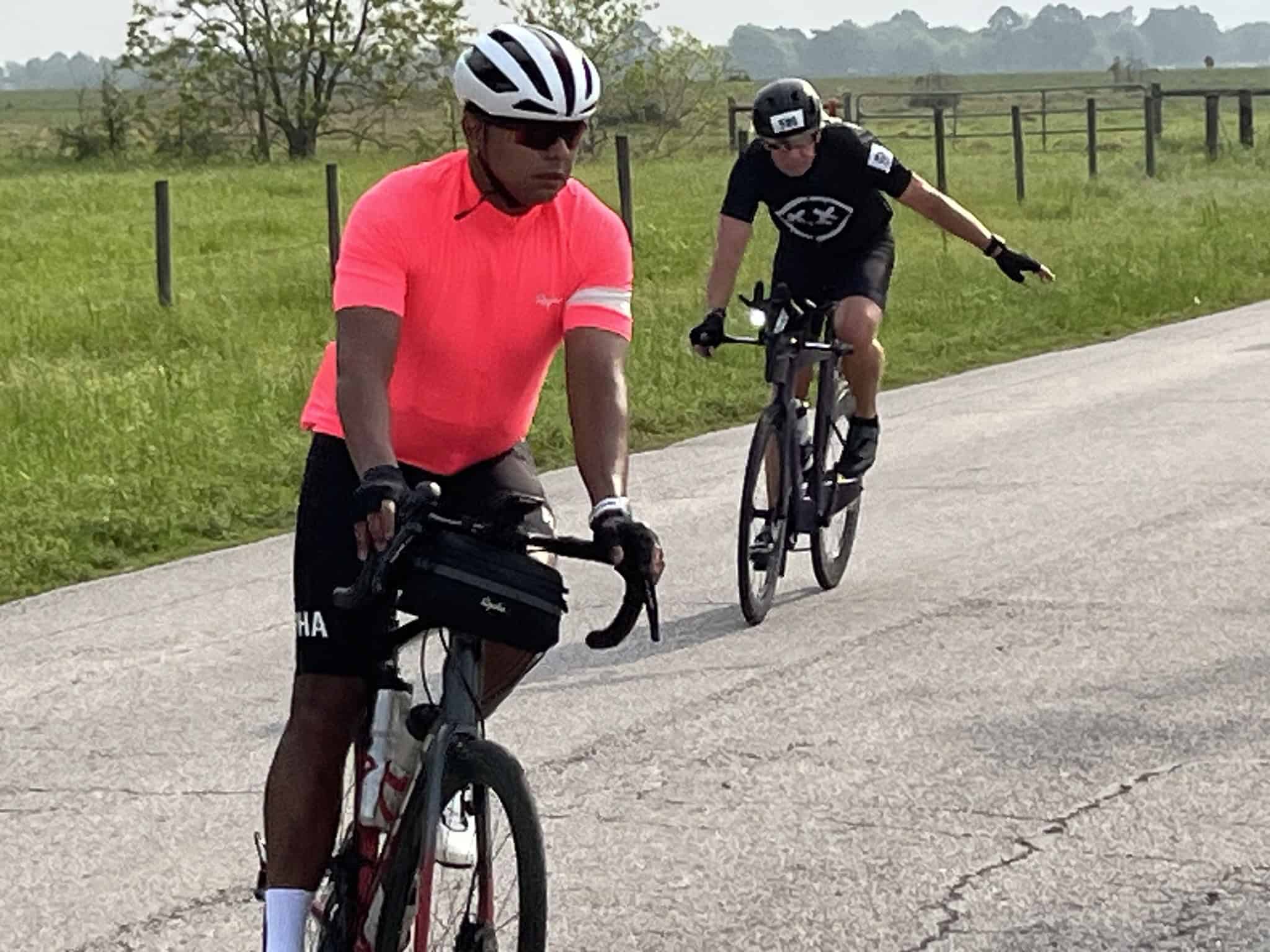 Bicycle riders enjoying scenic ride on the Bluebonnet Express trail in Texas countryside.