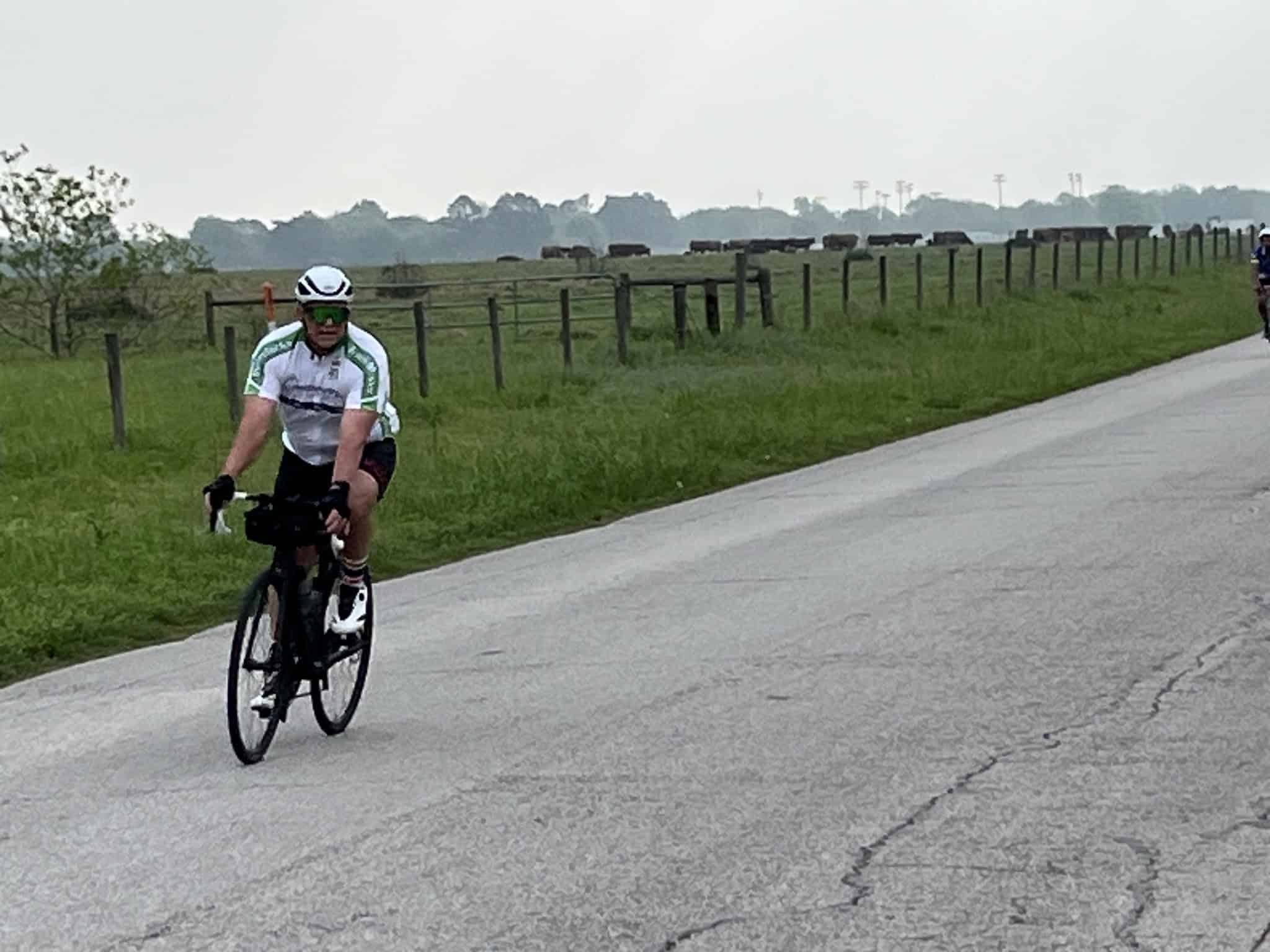 Bright outdoor cycling photo on a country road during daytime.