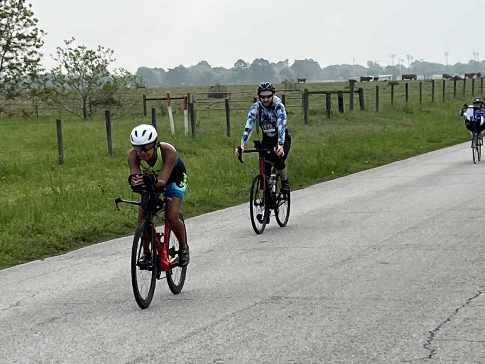 Cyclists riding on a rural road during a Bluebonnet Express cycling event.