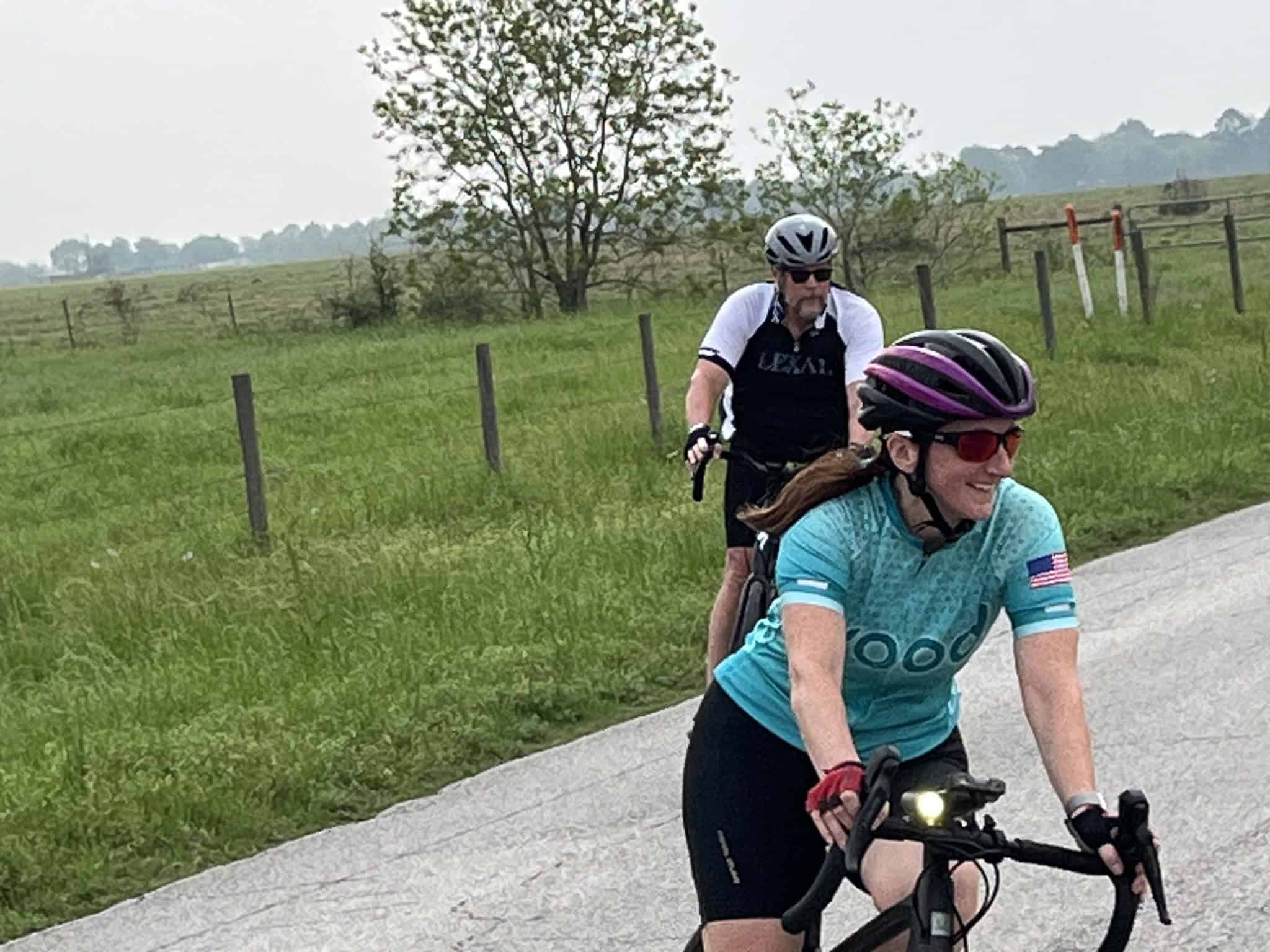 Brighton Bluebonnet Express cyclist team riding on scenic countryside road, enjoying outdoor biking adventure.