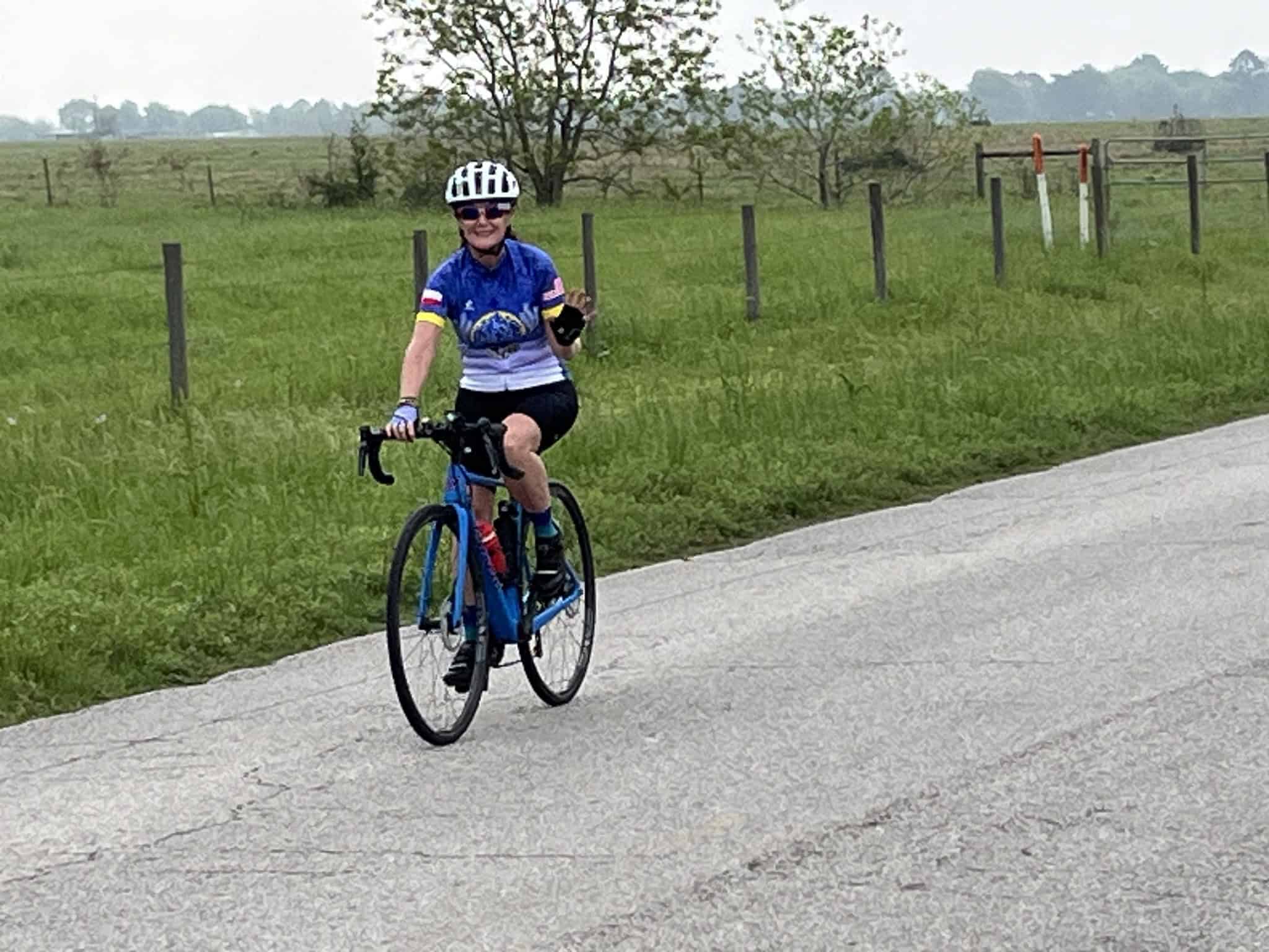 Comfortable cyclist enjoying outdoor ride on Bluebonnet Express trail, promoting active lifestyle.