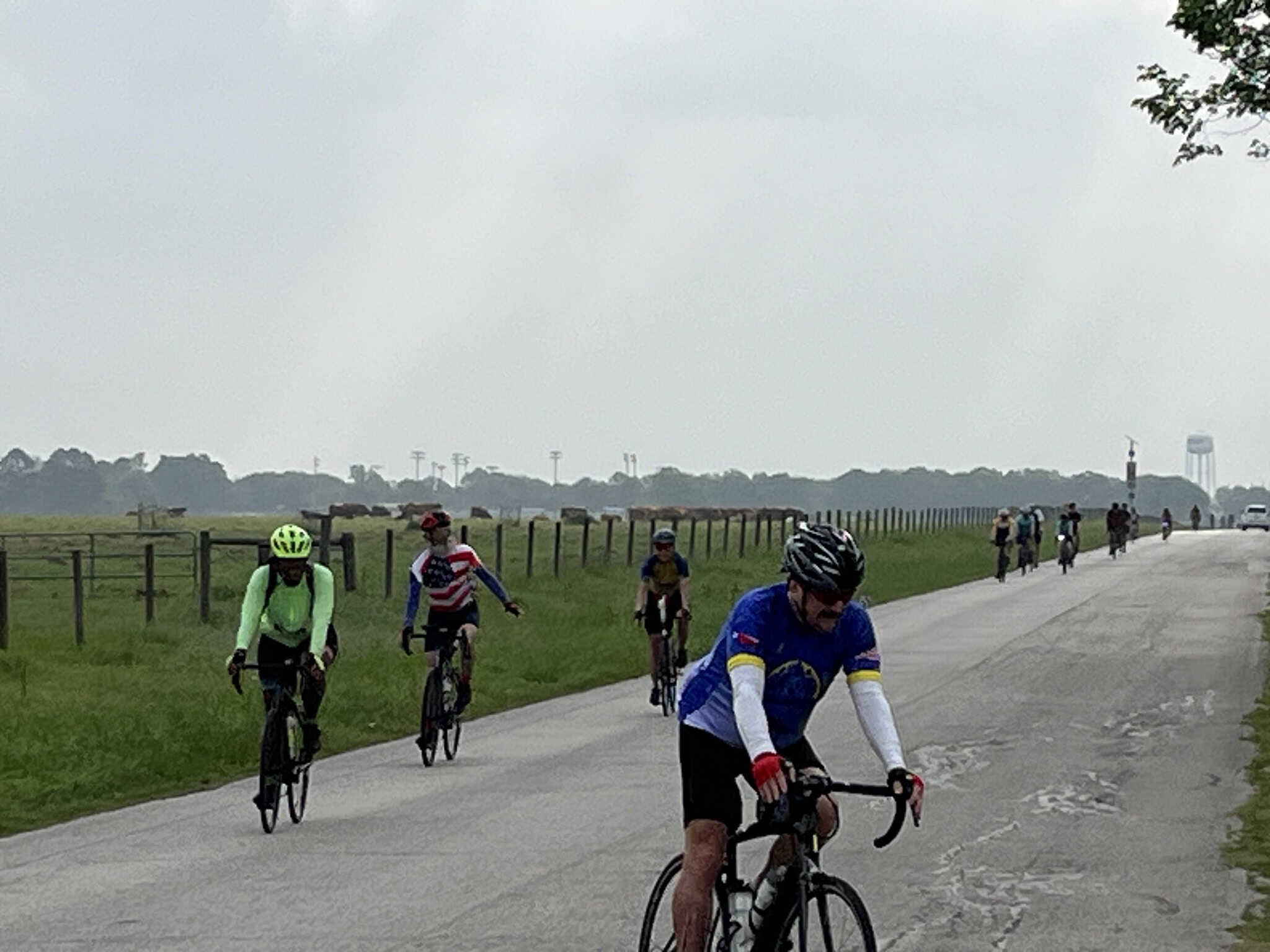 Cyclists riding on a rural bike path in the countryside.