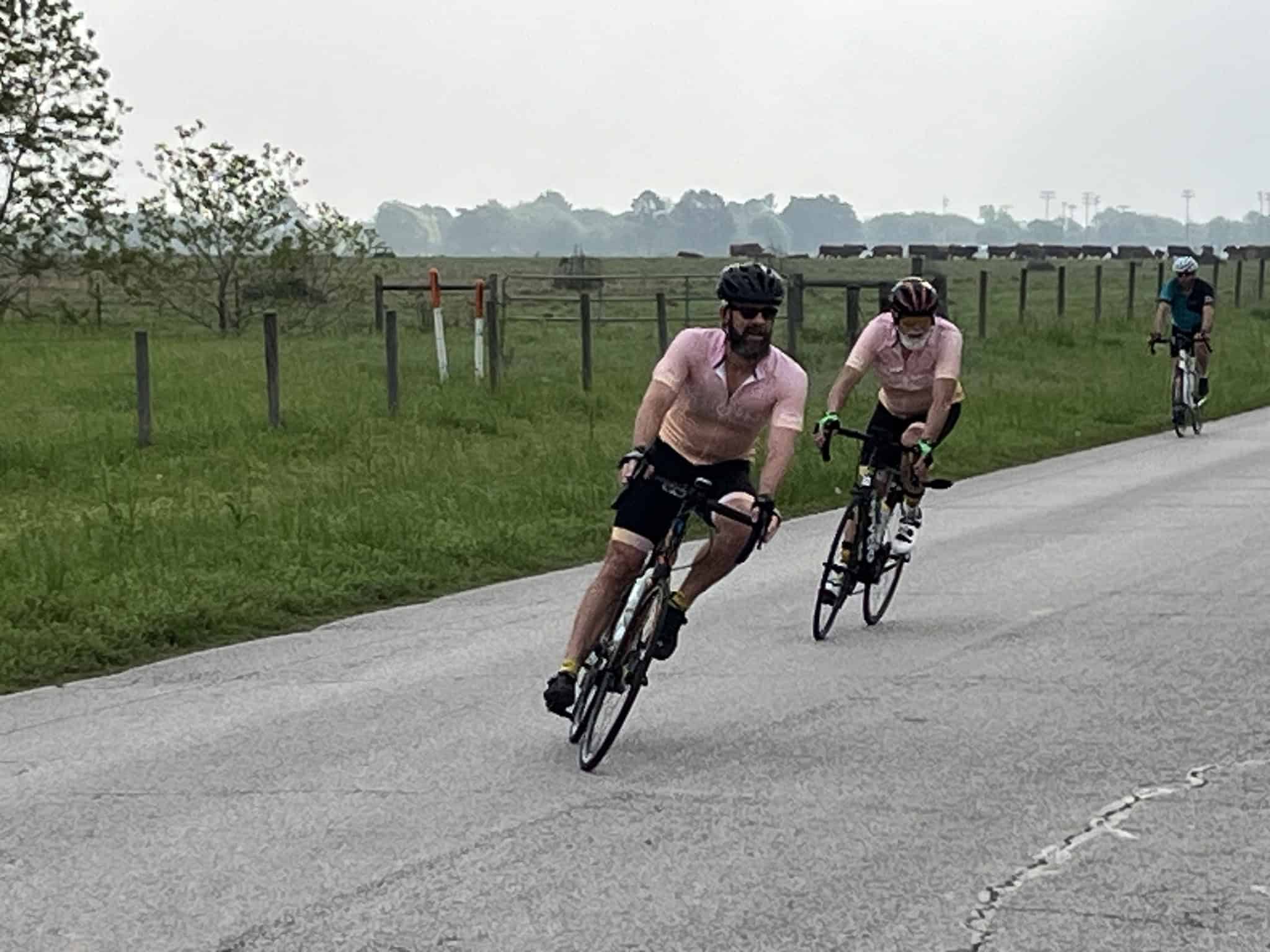 Bicycle riders enjoying a scenic ride along Bluebonnet Express route in nature.