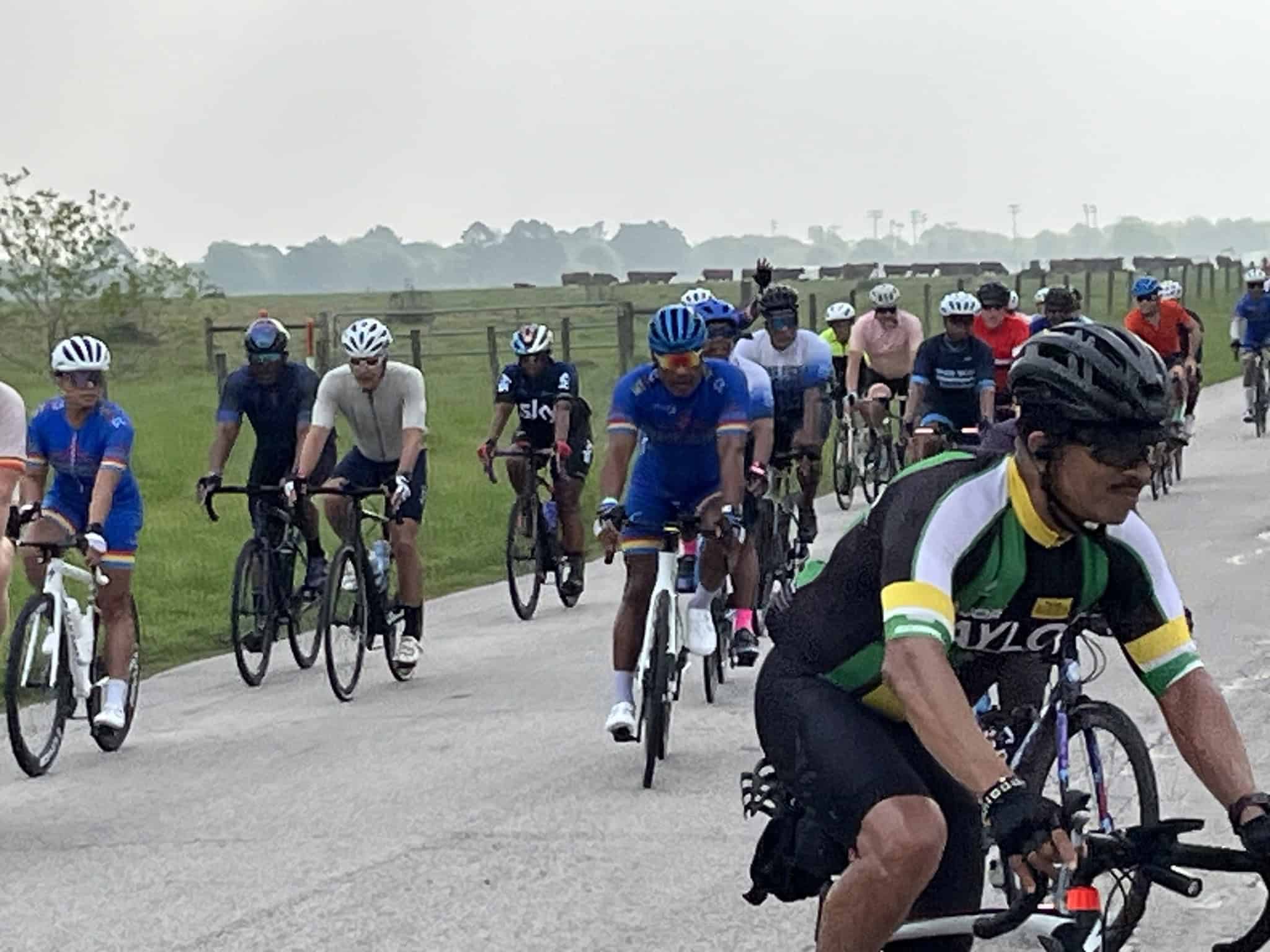 Cyclists participating in the Bluebonnet Express ride across scenic countryside in Texas.