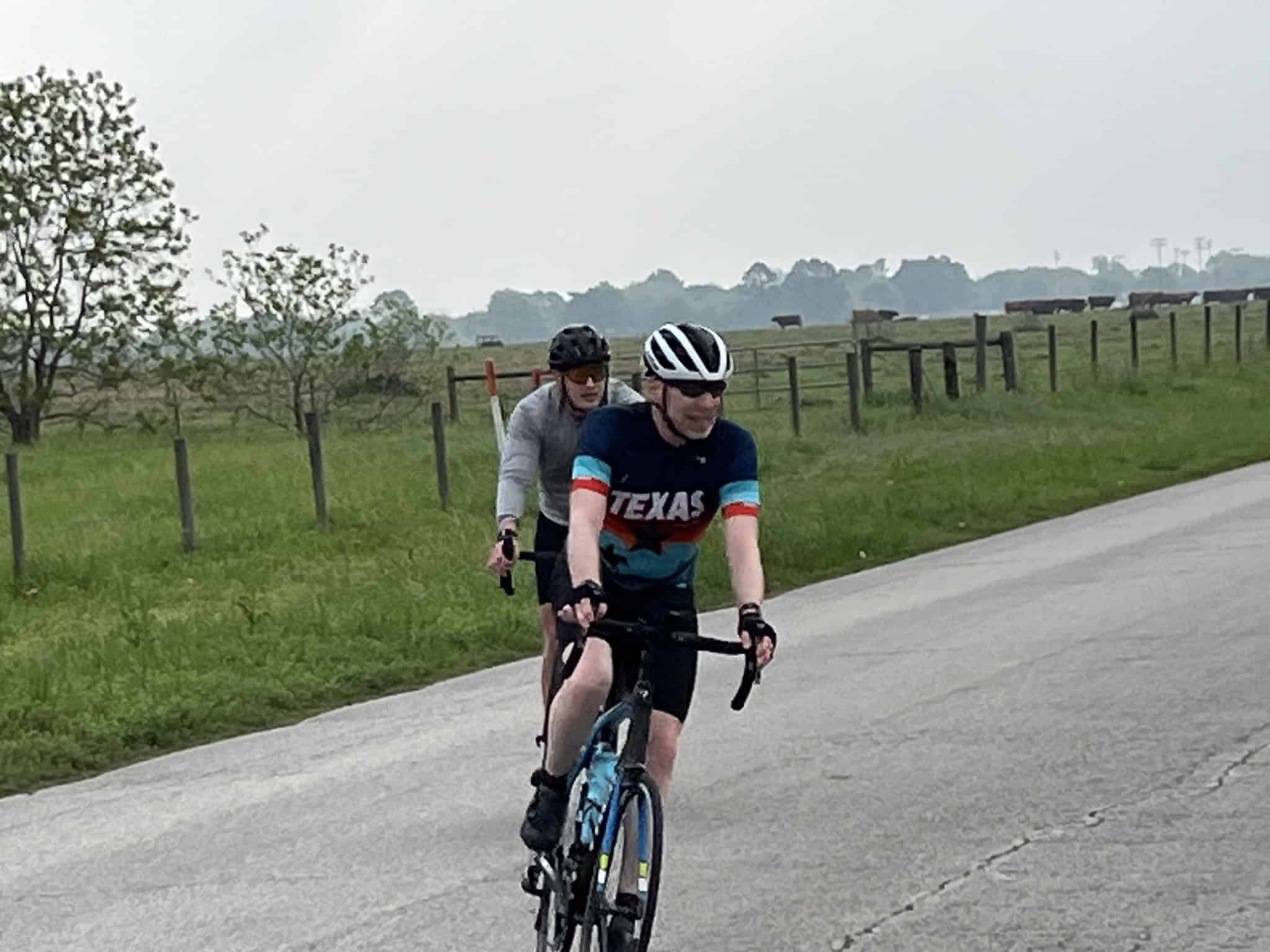 Riders on bicycles enjoying a scenic ride through the countryside, promoting outdoor activity and healthy lifestyle.