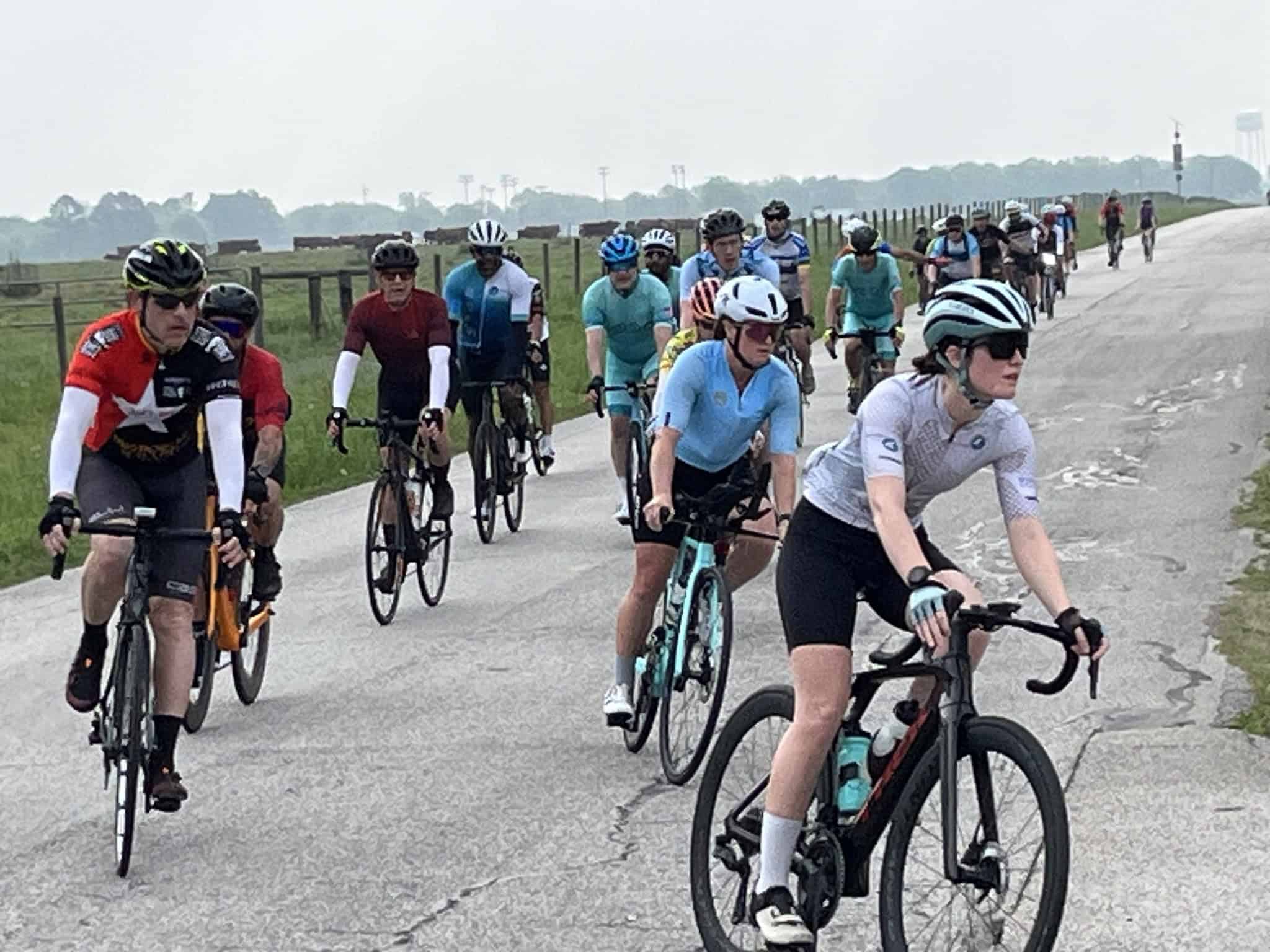 Cyclists riding scenic Bluebonnet Express route in Texas, enjoying outdoor bike race event.