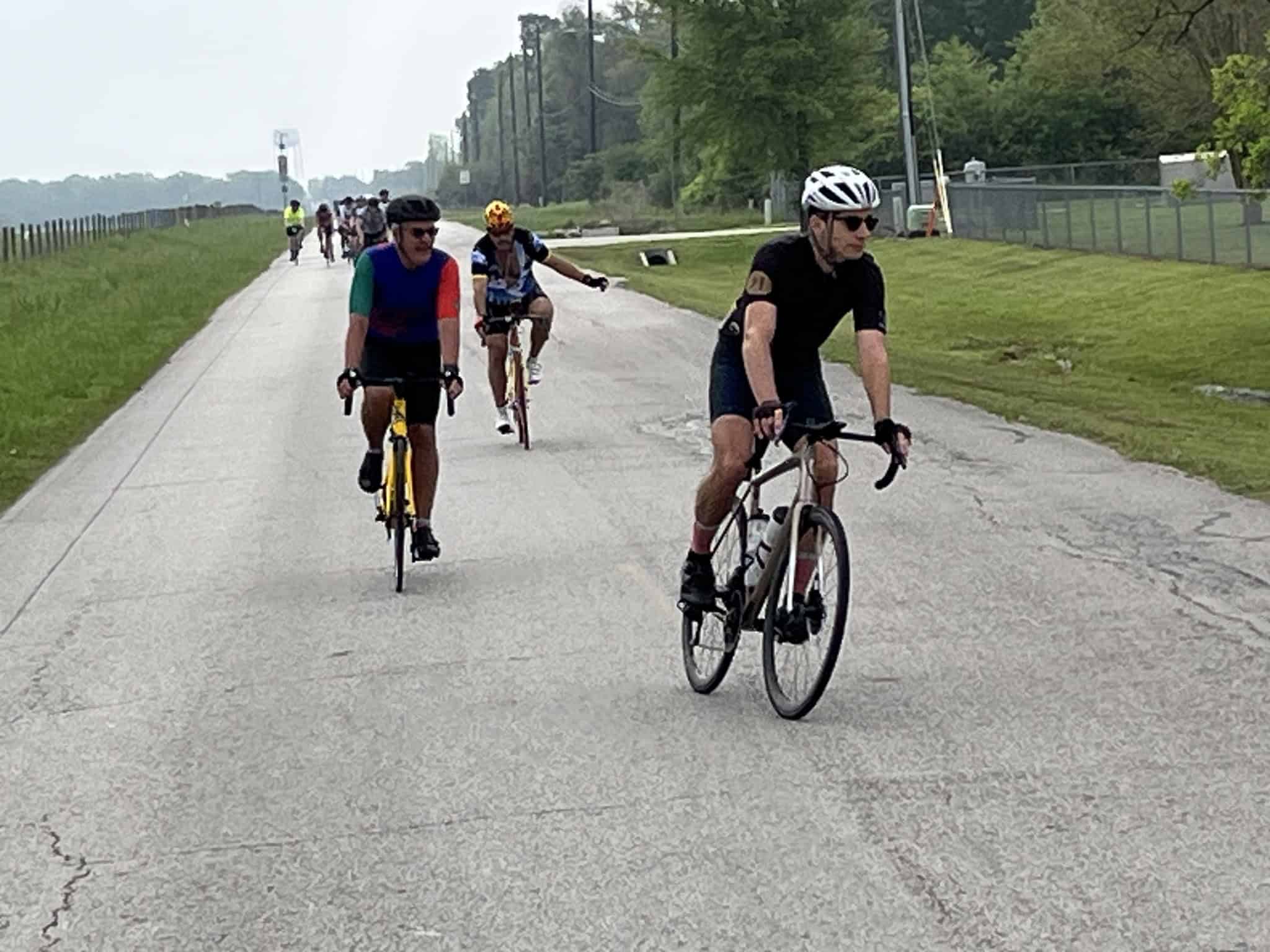 Biking group on a scenic outdoor trail, enjoying a ride with fellow cyclists on a sunny day.