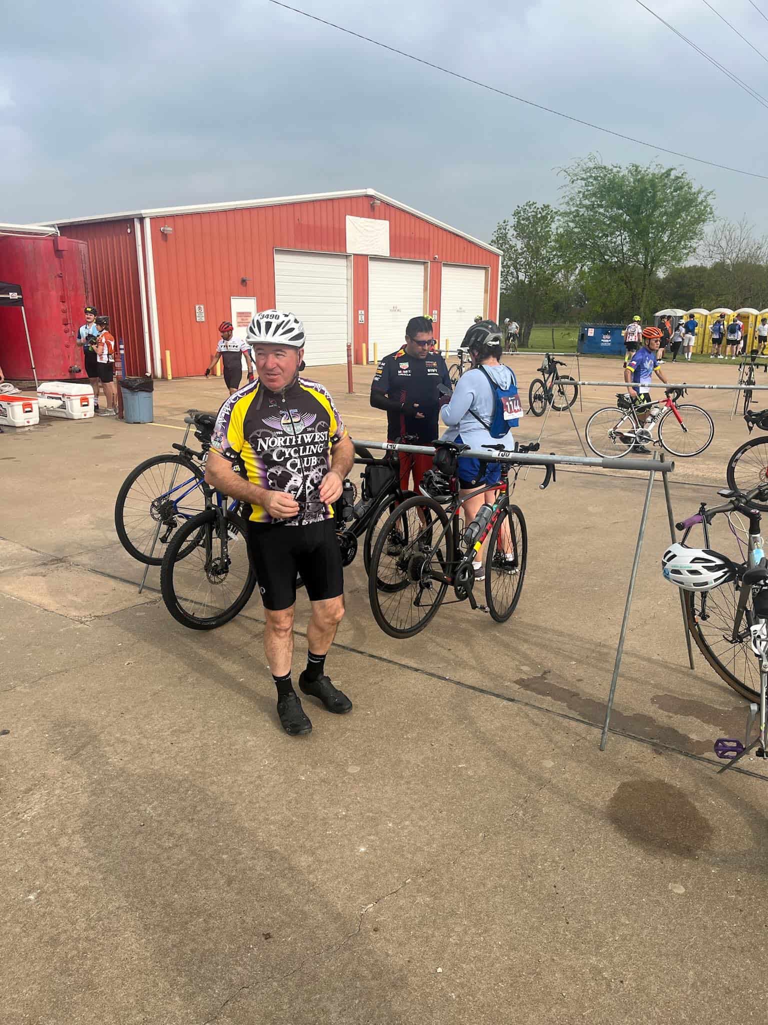Cyclist in North West Cycling Club gear at Bluebonnet Express event.