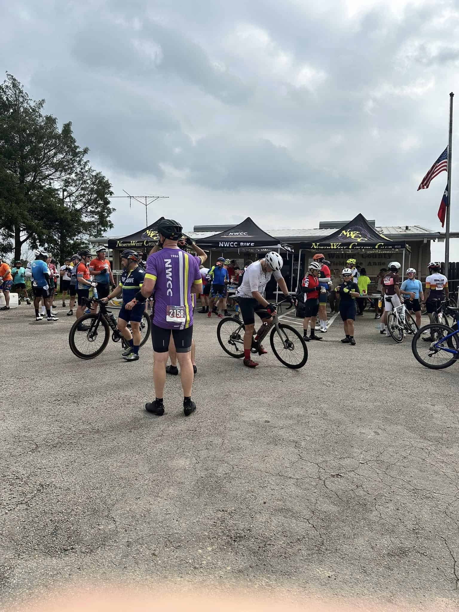 Cyclists preparing for Bluebonnet Express cycling event at North West Cycling Club.