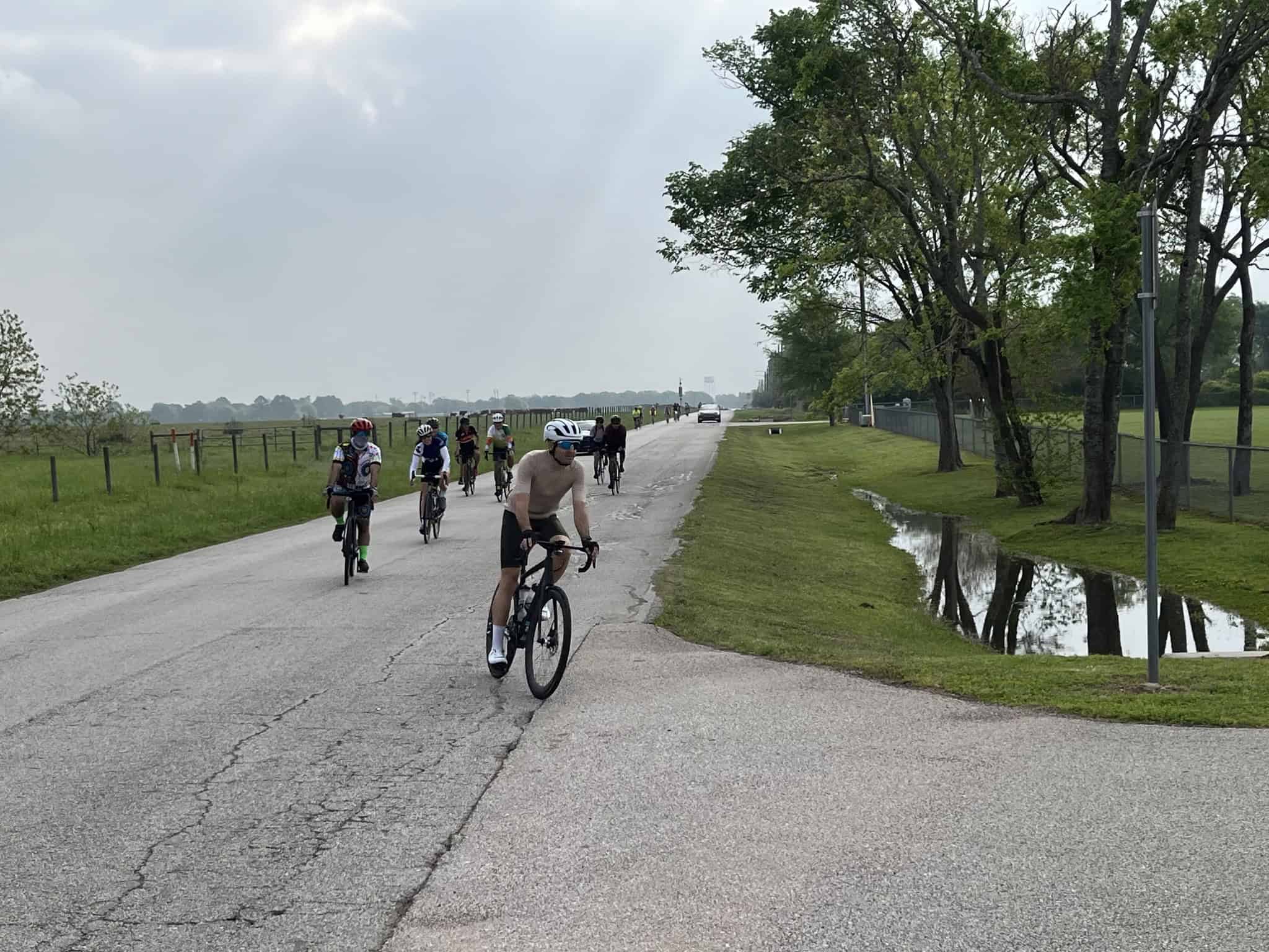 Cyclists enjoying a scenic ride on Bluebonnet Express bike trail in Texas.