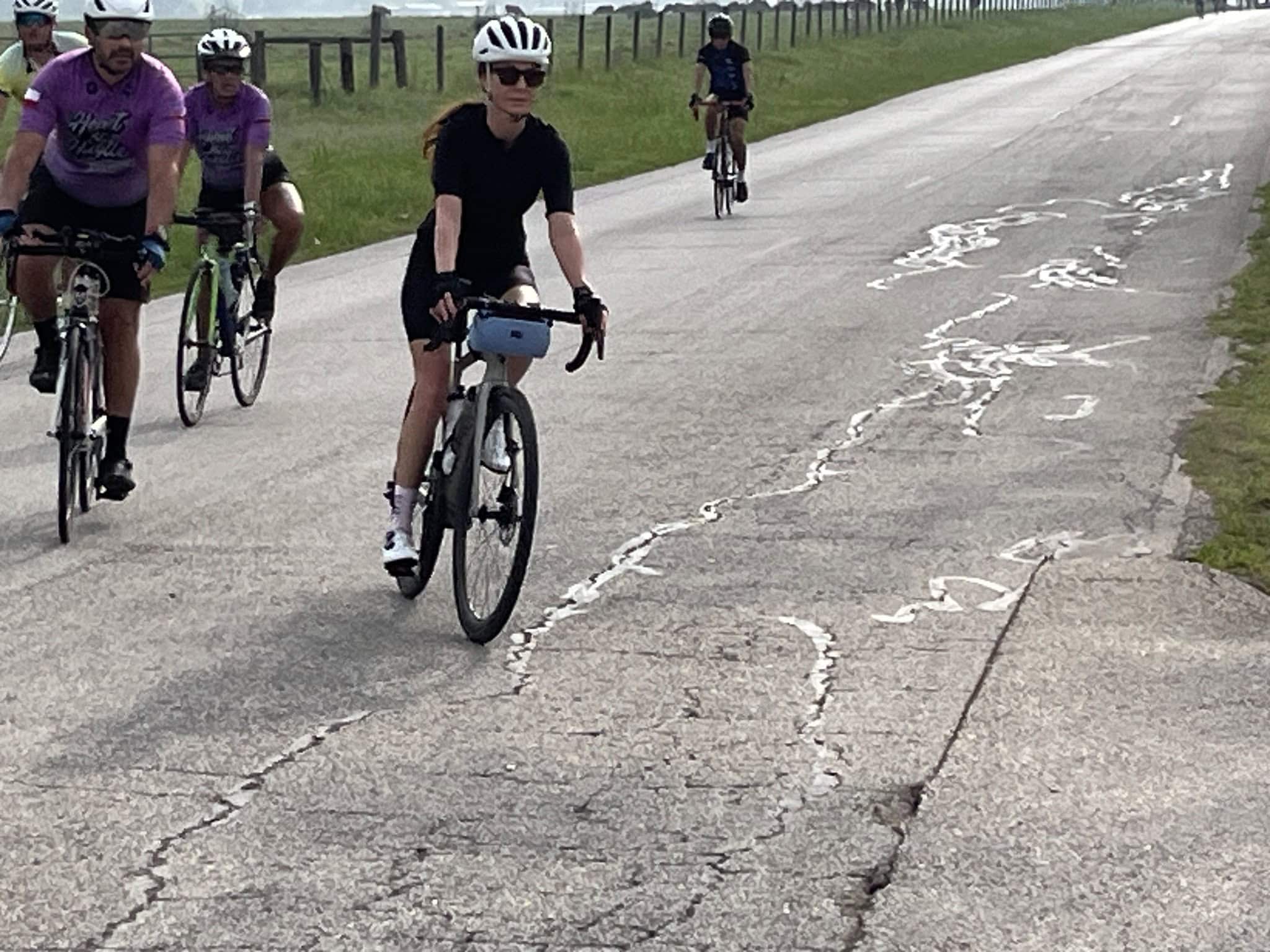 Vibrant cyclists riding on a scenic outdoor trail, showcasing adventure and outdoor activity.