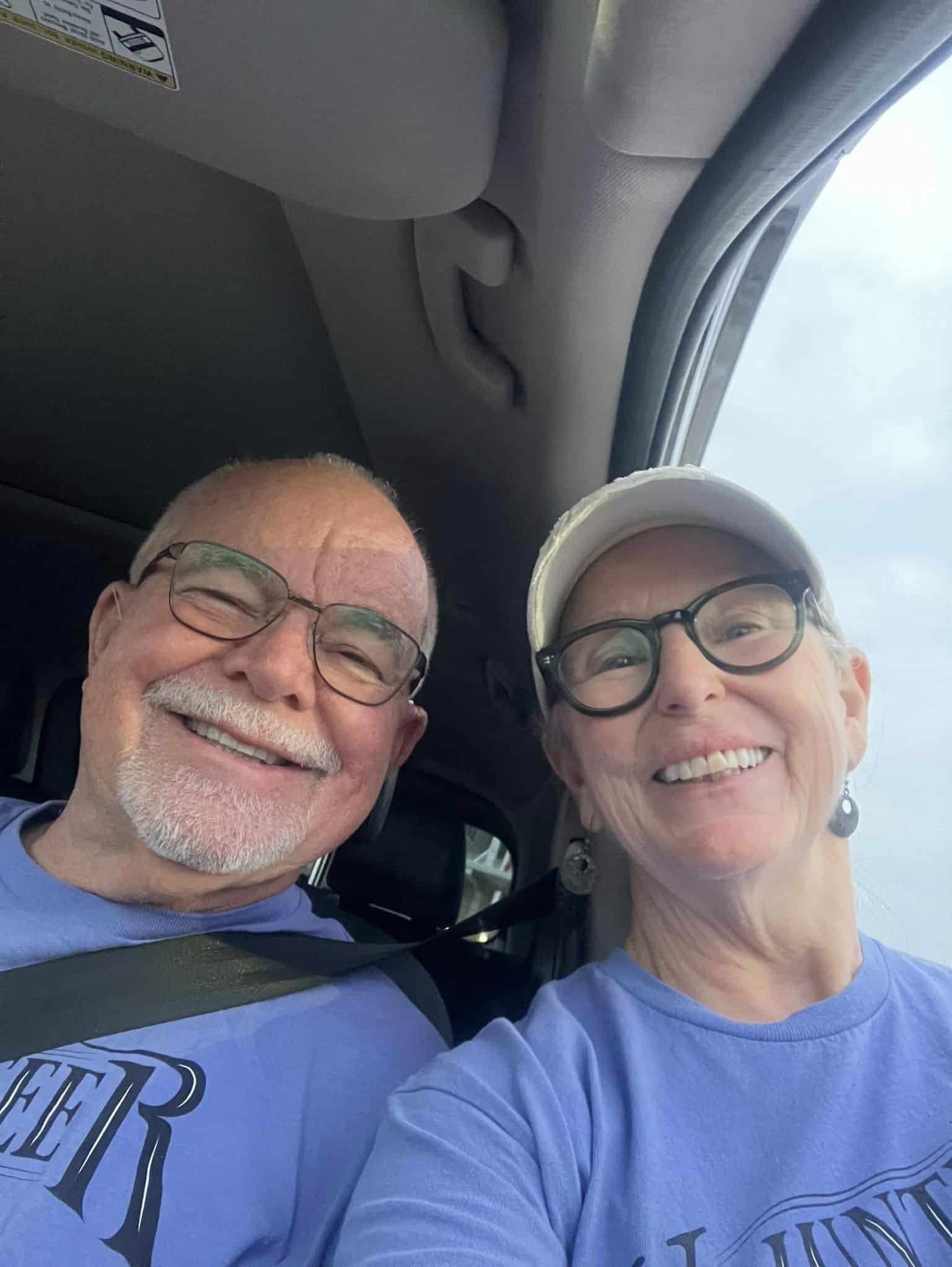 Comfortable passengers on the Bluebonnet Express bus, smiling and enjoying their ride.