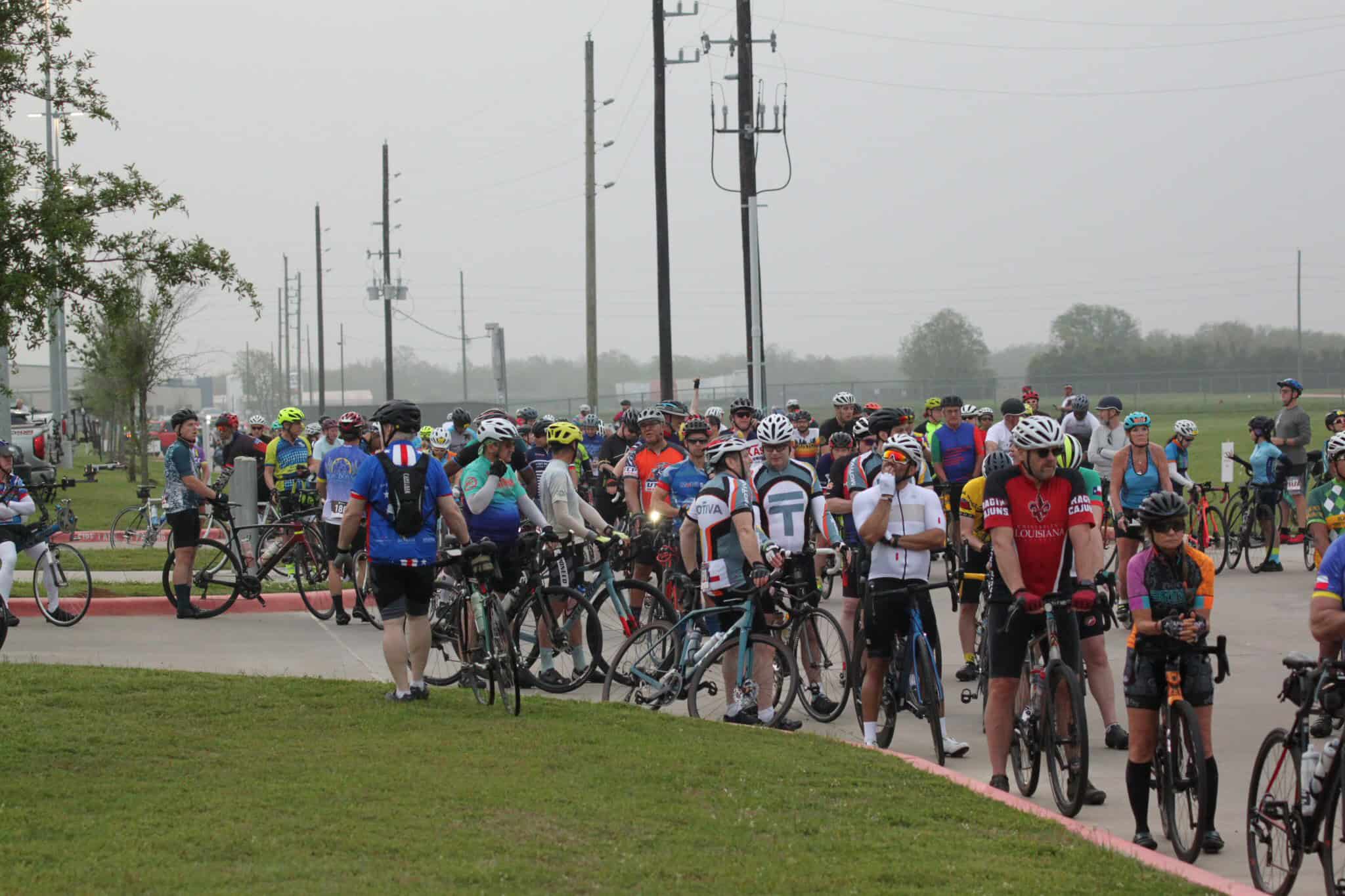 Cyclists gathering at Bluebonnet Express cycling event for outdoor fitness and community fun.
