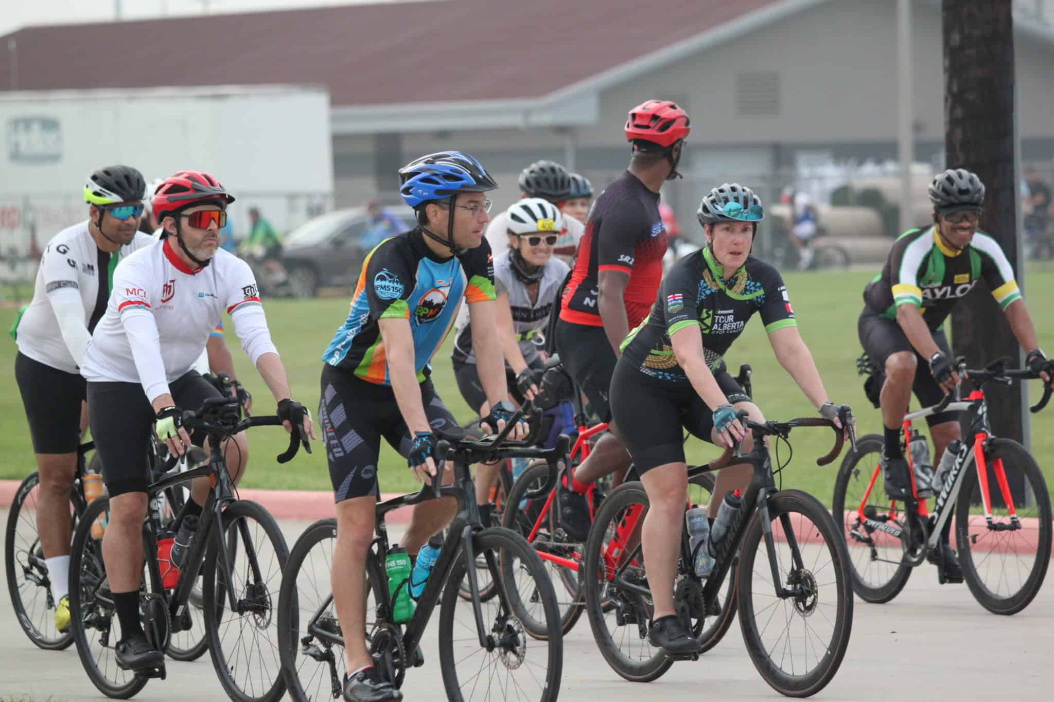 Cyclists participating in a group ride for Bluebonnet Express cycling event, emphasizing community and cycling sport.