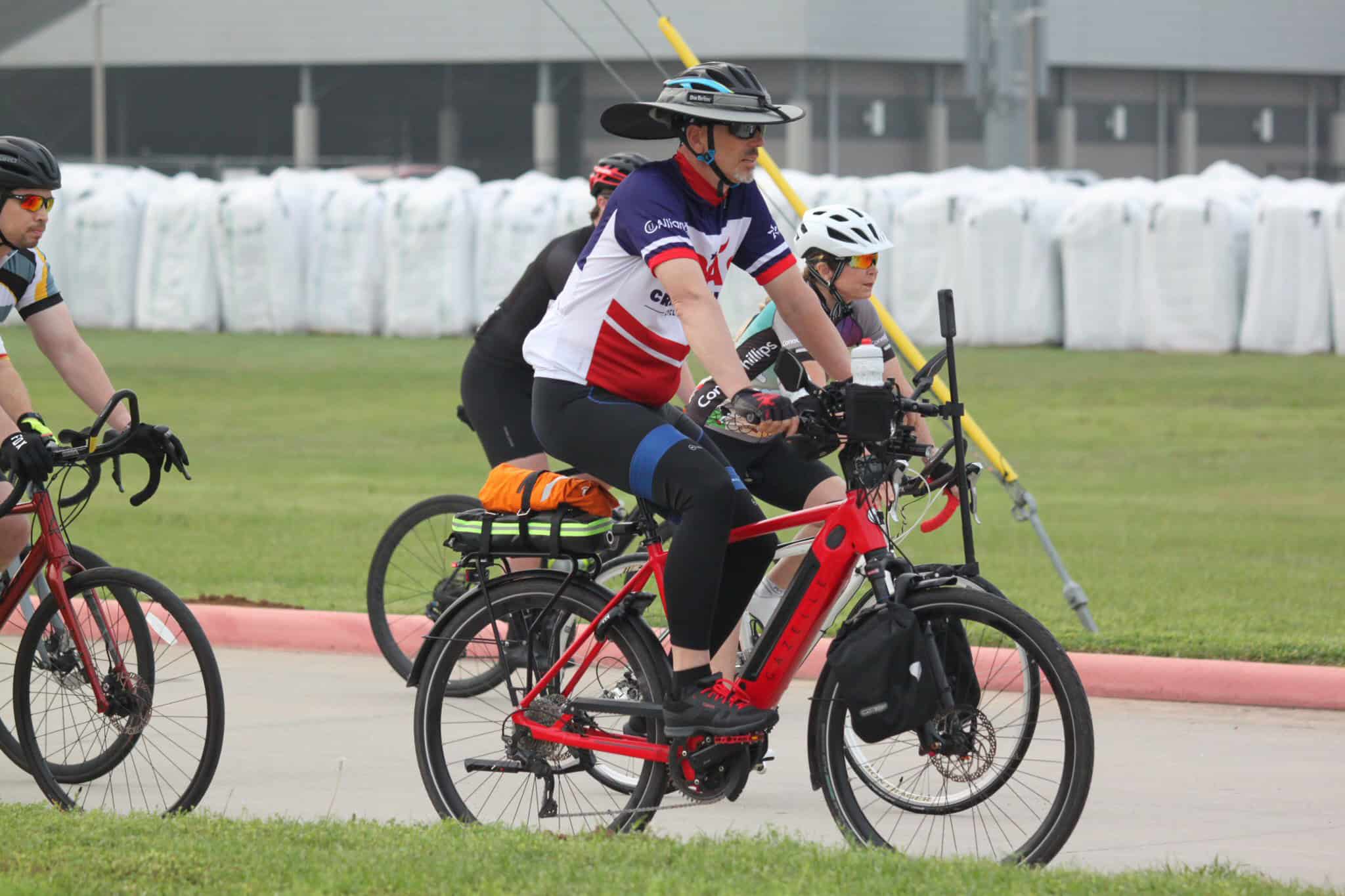 Eco-friendly electric bicycle riding tour with Bluebonnet Express, promoting sustainable transportation and outdoor recreation.