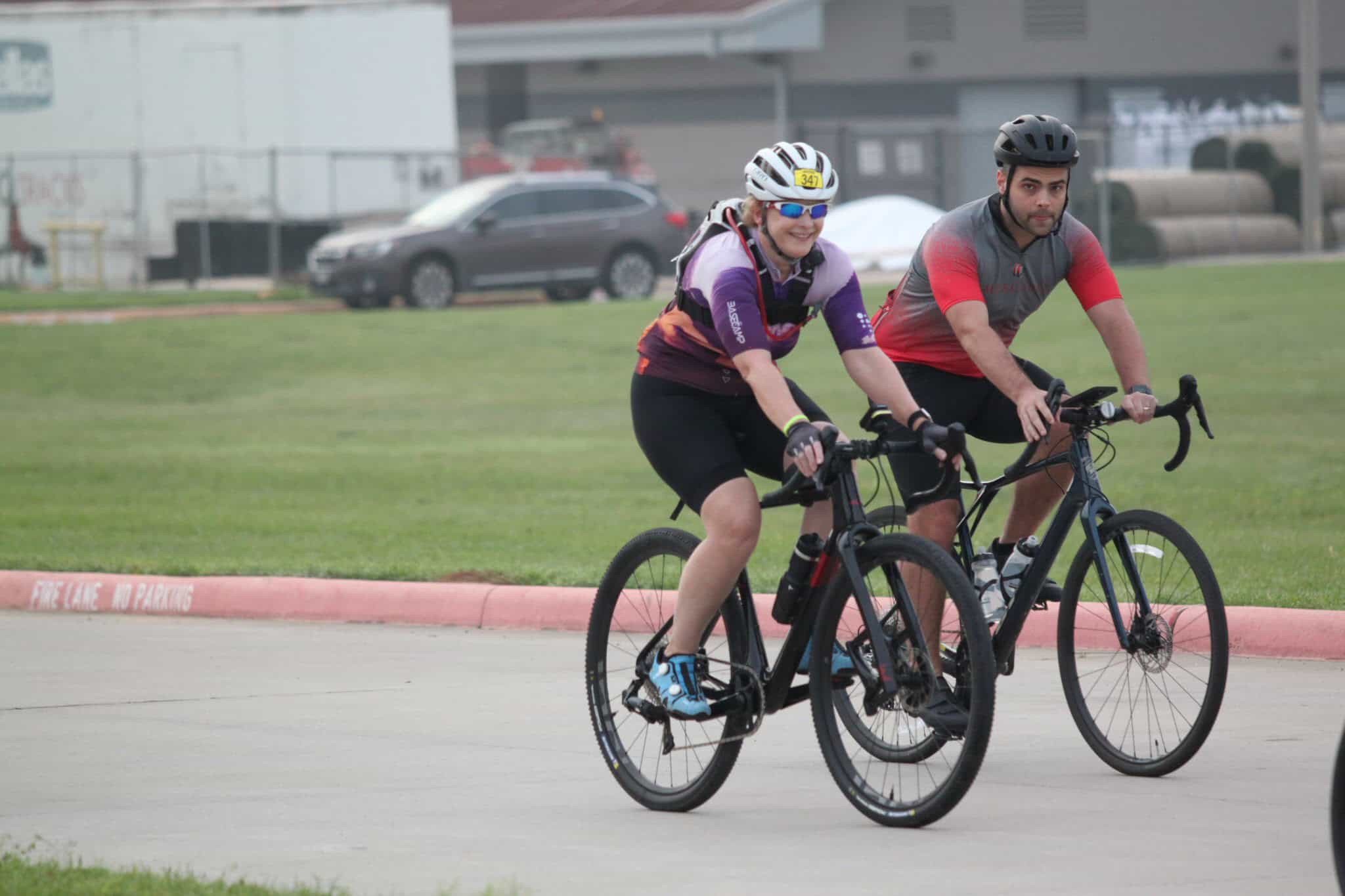 Cyclists riding mountain bikes outdoors, fitness, recreation, Bluebonnet Express event, biking adventure.