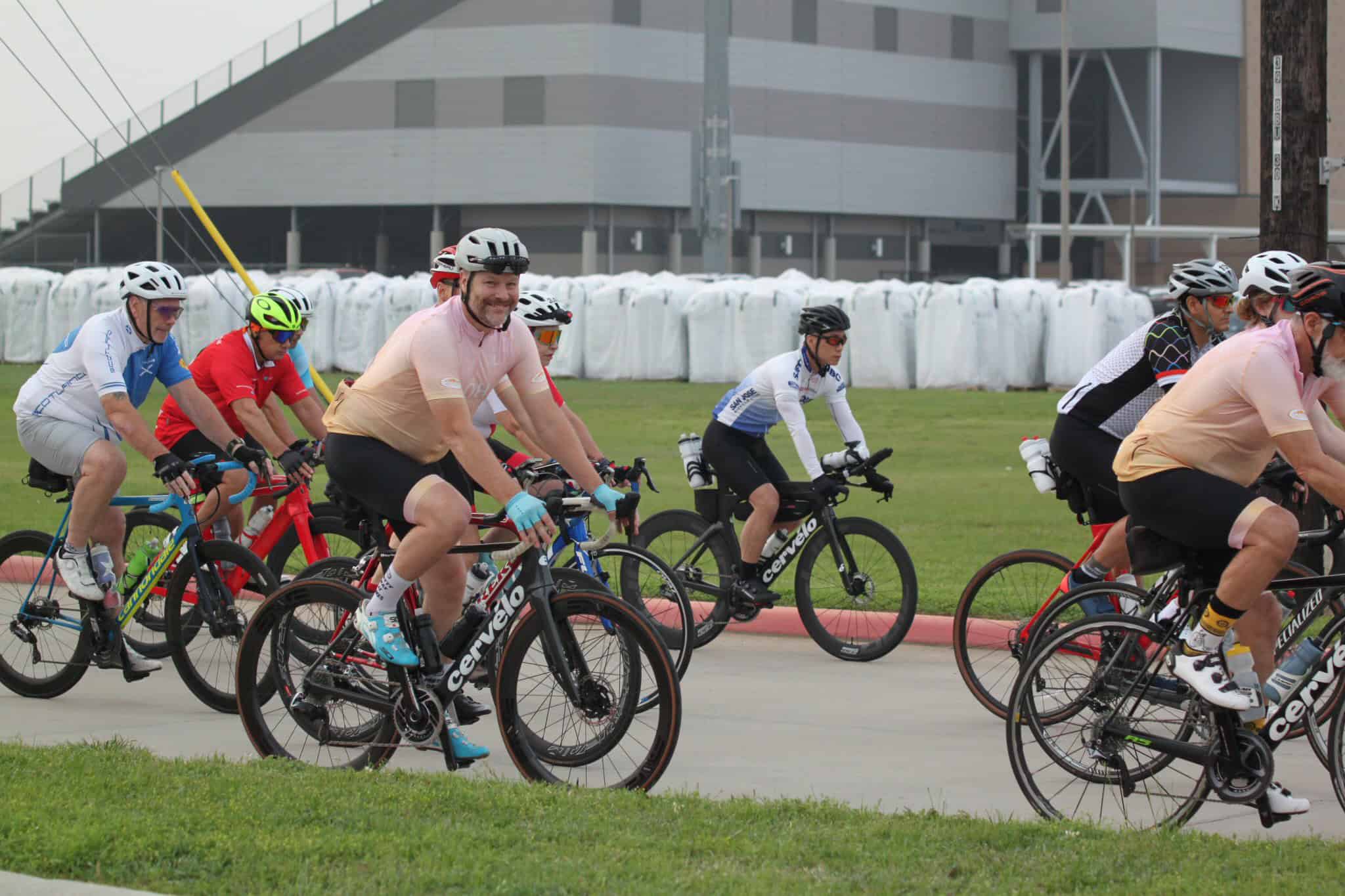Cyclists riding together during a group bike ride event, promoting community and outdoor activity.