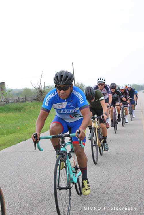 Bike race during Bluebonnet Express cycling event on open road.