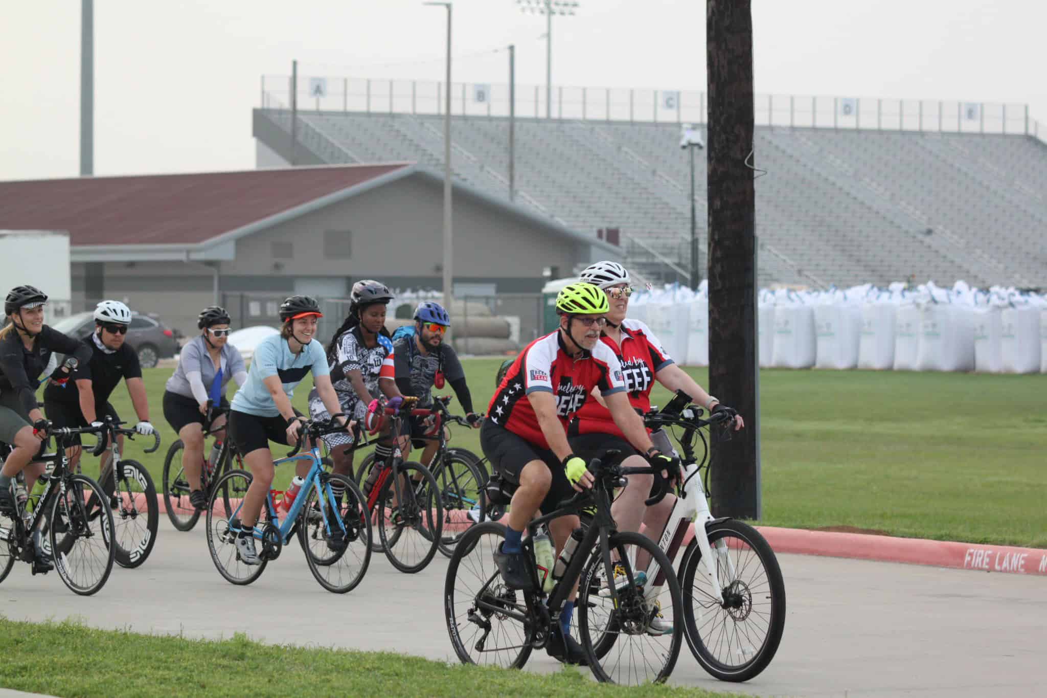 Vibrant group bike ride event promoting cycling and community at Bluebonnet Express.