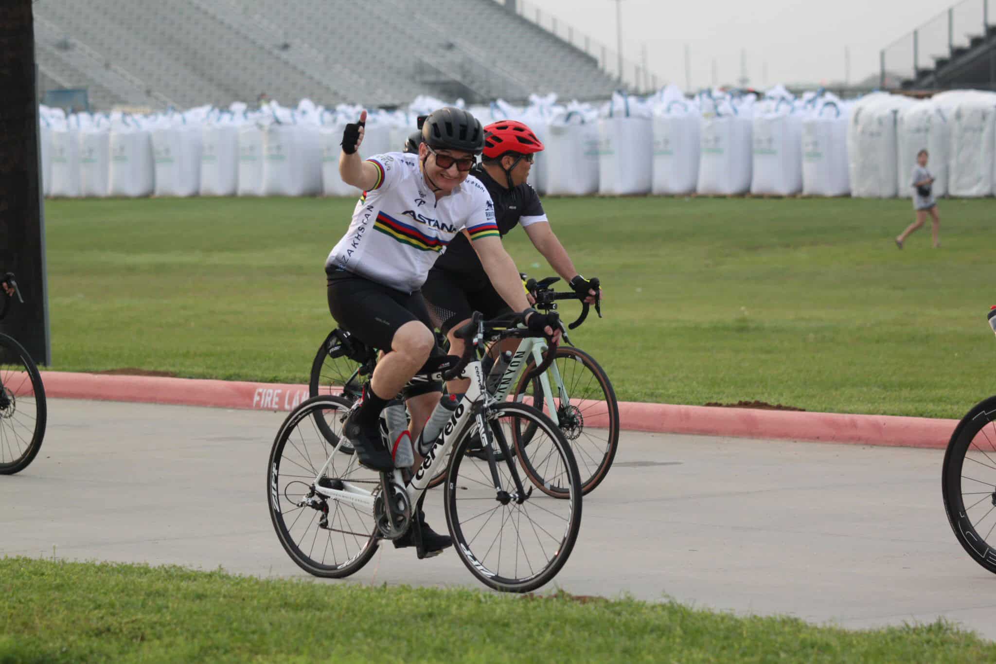 Energetic cyclist enjoying Bluebonnet Express cycling event, promoting outdoor fitness and adventure.