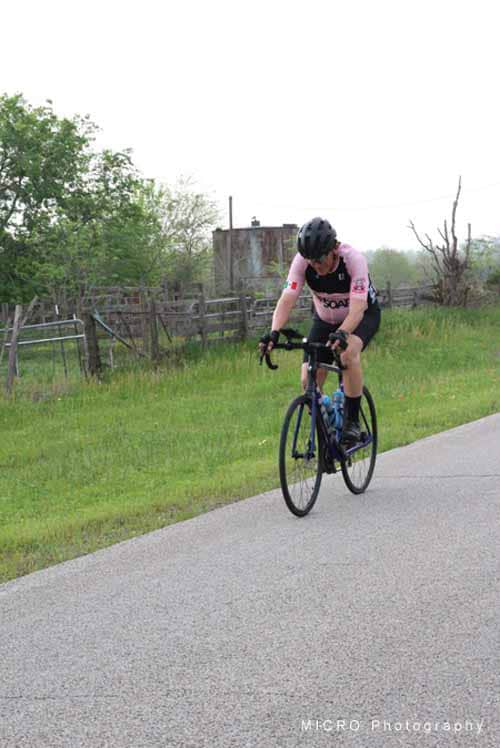 Vastcycling, cyclist on rural bike trail, Bluebonnet Express, outdoor cycling adventure, fitness, eco-friendly transportation.