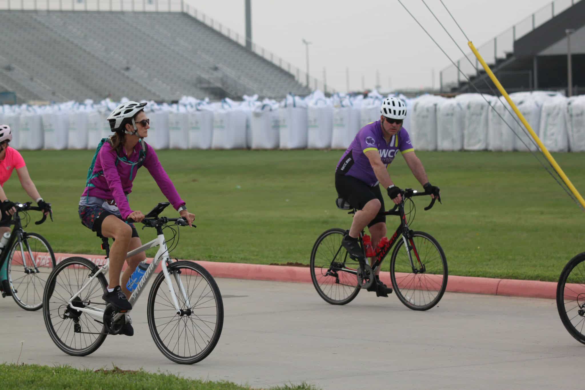 Cyclists riding on a track during Bluebonnet Express bike event.