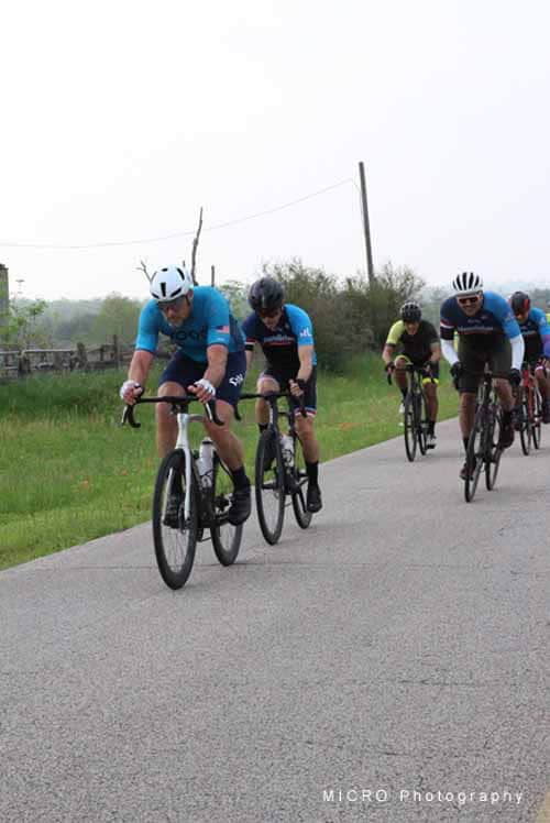 Endurance cyclists on Bluebonnet Express scenic ride, enjoying a group bike tour in Texas countryside.