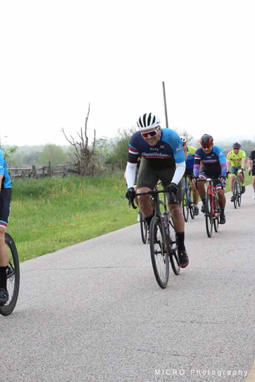 Cyclist riding on a scenic trail during Bluebonnet Express bike event.